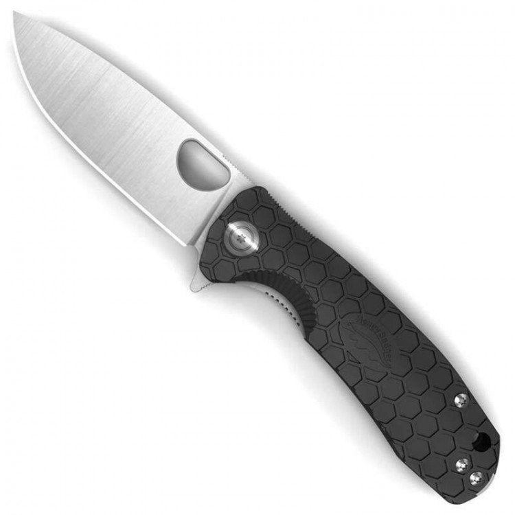 Folding knife with a black handle on a white background