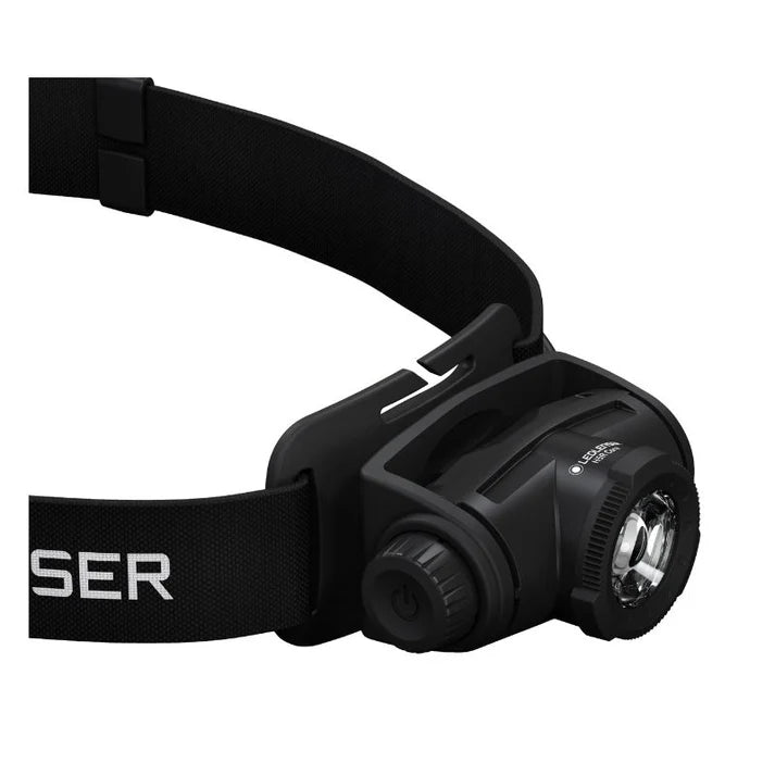 Black headlamp with a strap on a white background